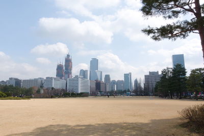 View of buildings against cloudy sky