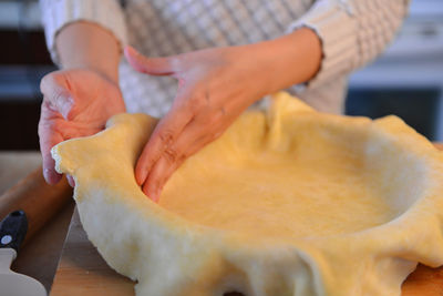 Midsection of woman working on table