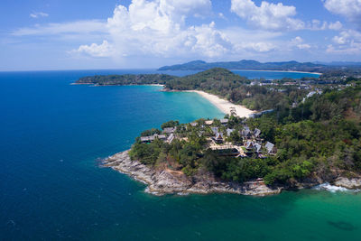 Scenic view of sea and buildings against sky