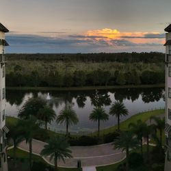 Scenic view of swimming pool against sky at sunset