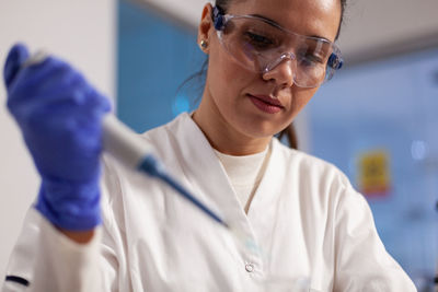 Scientist experimenting at laboratory