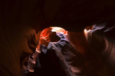 Midsection of woman standing in dark