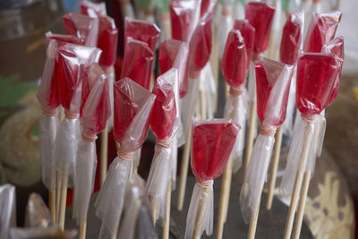 Close-up of candies wrapped in plastic for sale at market stall