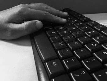 Cropped image of man typing on keyboard