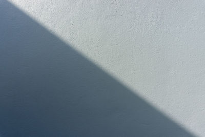 High angle view of shadow on wall