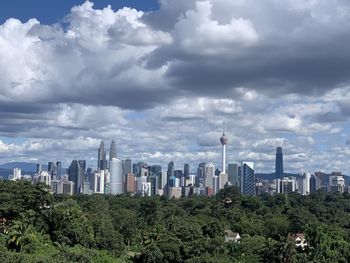 Modern buildings in city against sky