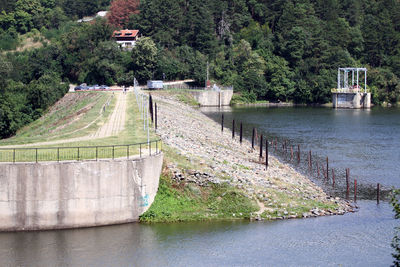 Scenic view of dam by river