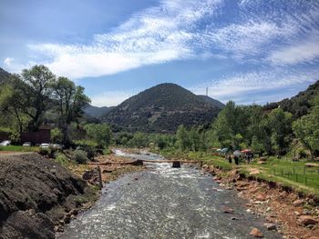 Scenic view of landscape and mountains against sky