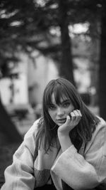 Portrait of smiling young woman outdoors