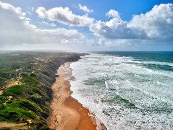 Scenic view of beach against sky