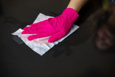 High angle view of pink umbrella on paper