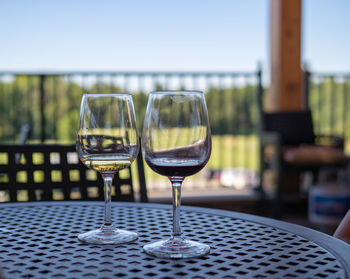 Close-up of wine glasses on table