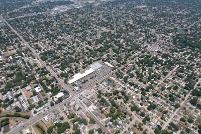 High angle view of crowd on road amidst buildings in city