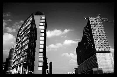 Low angle view of building against cloudy sky