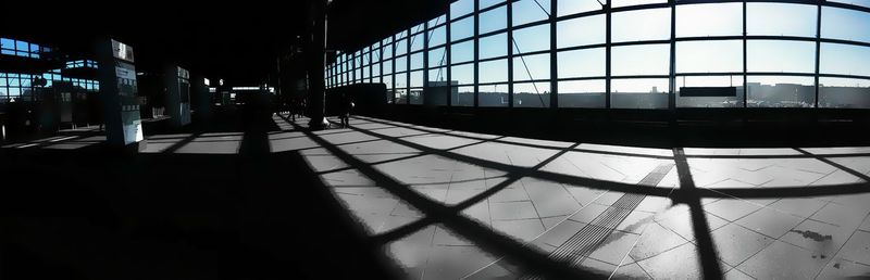 Shadow of man on railroad station