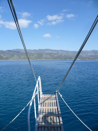 Sailboat on sea against sky