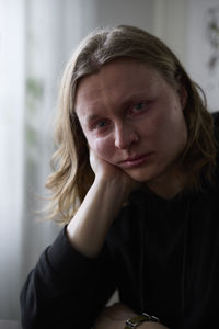 Portrait of crying woman looking at camera