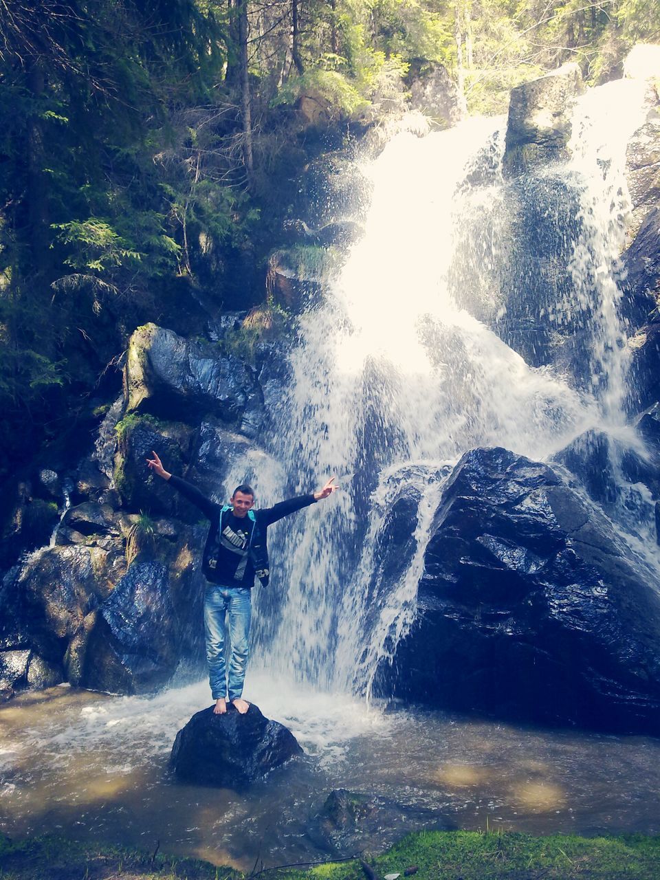 water, motion, lifestyles, leisure activity, men, waterfall, rock - object, flowing water, nature, splashing, waterfront, beauty in nature, adventure, river, scenics, travel, vacations, long exposure