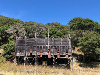 Train on field against clear sky