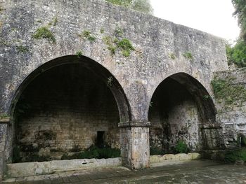 Old ruin bridge against sky