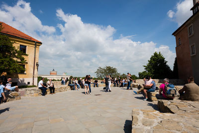 People at town square against sky