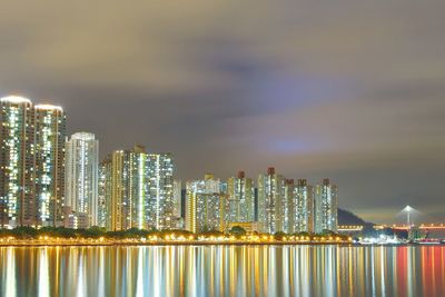 Illuminated city at waterfront