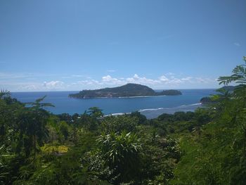 Scenic view of sea against blue sky