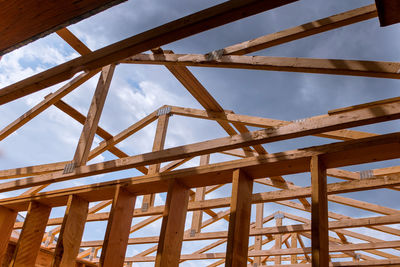 Low angle view of metallic structure against sky