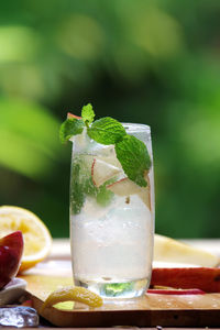 Close-up of apple mint juice on table