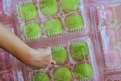 Japanese dessert colourful mochi in a clear packging containers.