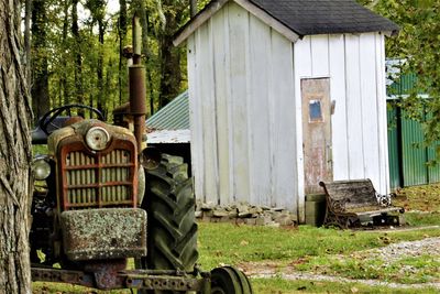 Old abandoned truck on field in forest