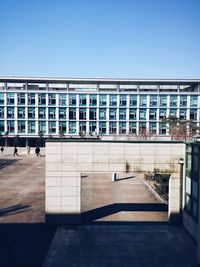 Buildings against clear blue sky