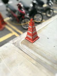 Red umbrella on road in city