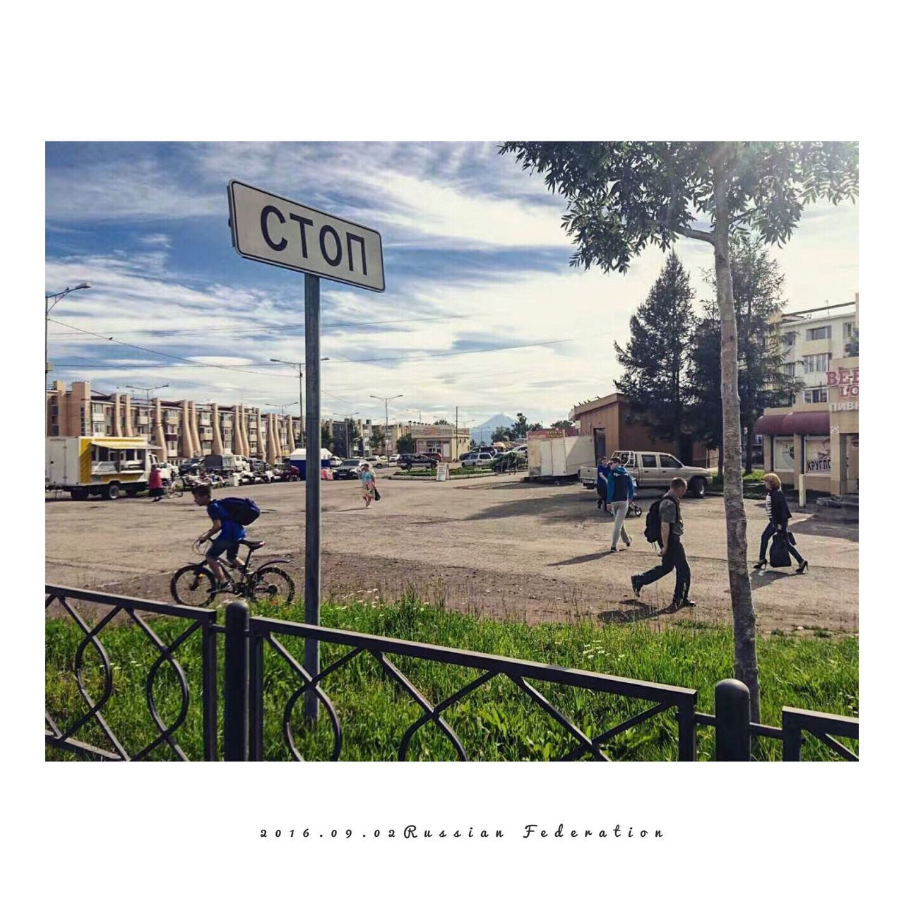 MAN RIDING BICYCLE ON STREET