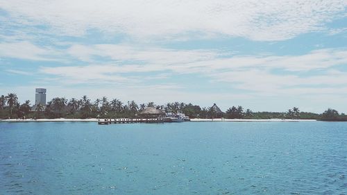 Scenic view of sea against cloudy sky