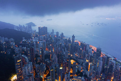 High angle view of illuminated buildings in city against sky
