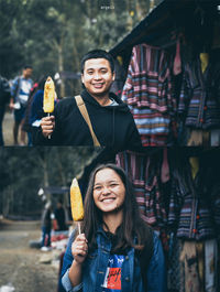 Portrait of smiling young woman holding ice cream