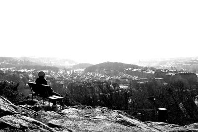 Woman sitting on landscape