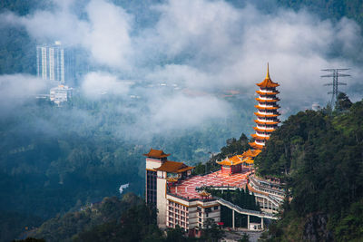 Aerial view of buddhist temple in a forest located in genting highland, malaysia