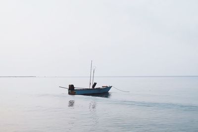 Boat on sea against clear sky