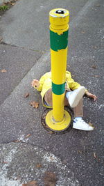 Yellow umbrella on street