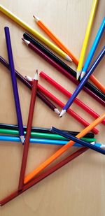 High angle view of multi colored pencils on table