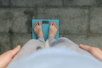 Low section of woman on floor