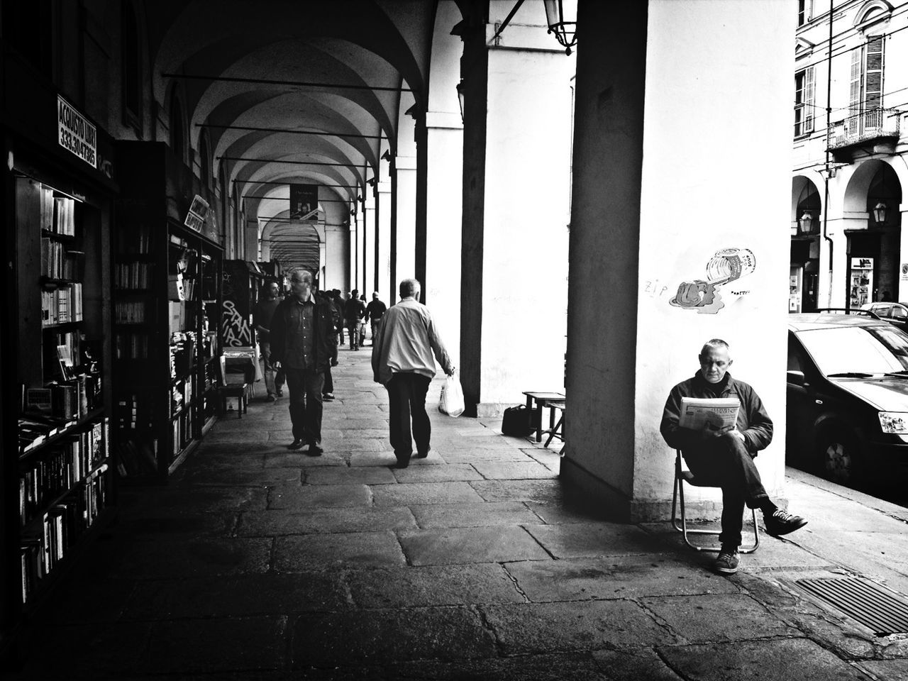 architecture, built structure, walking, full length, lifestyles, men, indoors, person, rear view, arch, the way forward, leisure activity, building exterior, casual clothing, corridor, city life, city, day