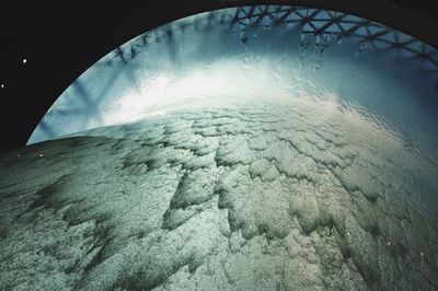 Low angle view of frozen sea against sky