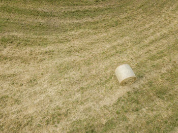 High angle view of hay bale on agricultural field