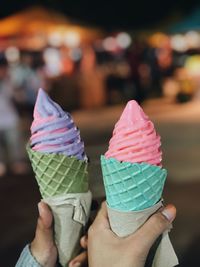 Cropped hand holding ice cream cone