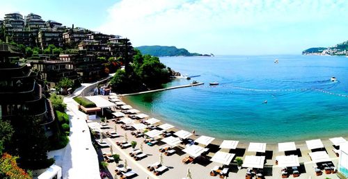 High angle view of swimming pool by sea against sky