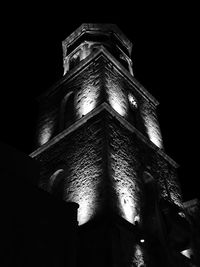 Low angle view of illuminated cross