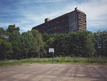 Basketball court with buildings in background